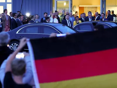 People protest as German Chancellor and Christian Democratic Union (CDU) party leader Friedrich Merz leaves a closed meeting with supporters in Braunsbedra, Germany, September 3, 2026. REUTERS/Christian Mang