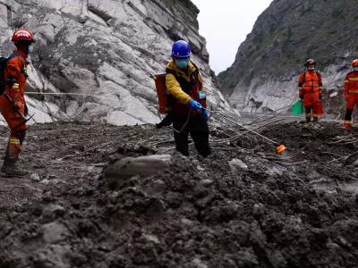 Rescue workers conduct search and rescue operations at the core disaster-hit area at Gyirong Port during an organised media tour in Shigatse, Tibet Autonomous Region, China, Sunday Sept. 6, 2026. (Tingshu Wang/Pool Photo via AP)