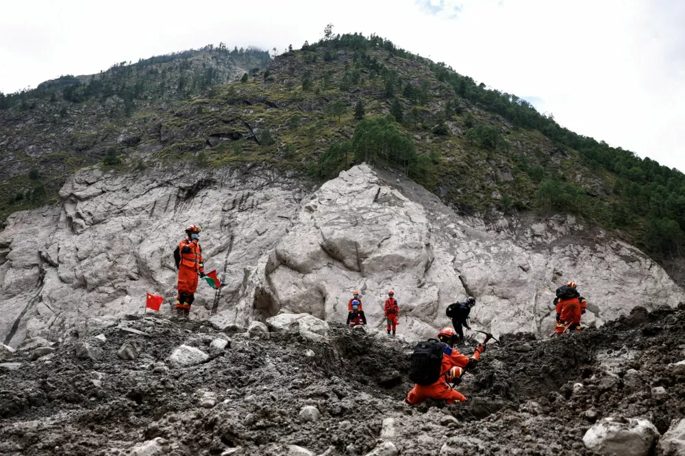 Rescue workers conduct search and rescue operations at the core disaster-hit area at Gyirong Port following the August 26 mudslide, during an organised media tour in Shigatse, Tibet Autonomous Region, China September 6, 2026. REUTERS/Tingshu Wang/Pool   TPX IMAGES OF THE DAY