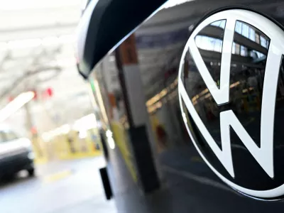 FILE PHOTO: The Volkswagen logo is displayed on a vehicle during a media tour at Volkswagen Commercial Vehicles (Volkswagen Nutzfahrzeuge) in Hanover, Germany, March 4, 2026. REUTERS/Fabian Bimmer/File Photo