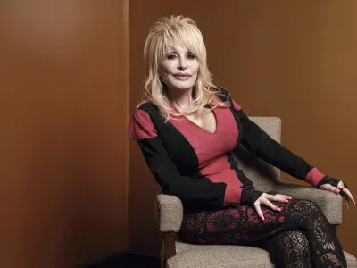 FILE - Dolly Parton poses at the Carnegie Medal of Philanthropy Ceremony in New York, on Oct. 13, 2022. (AP Photo/Andres Kudacki, File)