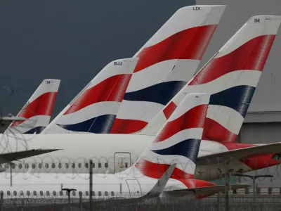 FILE PHOTO: Livery of British Airways passenger planes are seen at Heathrow Airport in west London, Britain, January 28, 2025. REUTERS/Toby Melville/File Photo