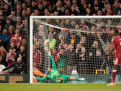 Atletico Madrid's goalkeeper Jan Oblak receives the second goal by Liverpool's Alexis Mac Allister during the Champions League opening phase soccer match between Liverpool and Atletico Madrid in Liverpool, England, Wednesday, Sept. 9, 2026. (AP Photo/Dave Thompson)