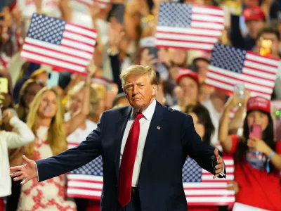 President Donald Trump greets supporters as he arrives on the stage at the Republican convention Thursday, Sept. 10, 2026, in Dallas. (AP Photo/Julio Cortez)