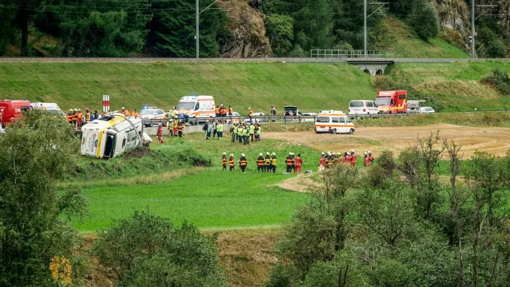 Emergency responders at the site of a crash involving a bus carrying a Dutch tour party, which flipped over in Susch, Switzerland, September 10, 2026.  Jon Duschletta/Engadiner Post/Handout via REUTERS  THIS IMAGE HAS BEEN SUPPLIED BY A THIRD PARTY. MANDATORY CREDIT. VERIFICATION - Road layout, buildings and a bridge matched archive and satellite imagery of the area. - Date verified by local authorities. - Police on Thursday (September 10) said a number of people were killed and several others injured after a bus carrying a Dutch tour party flipped over in a remote Alpine region of eastern Switzerland.