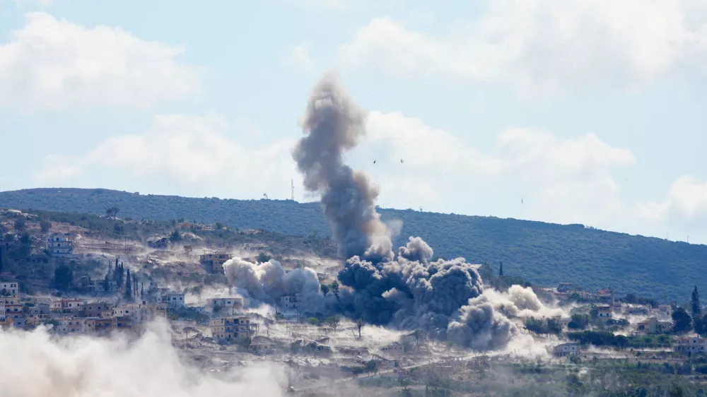 Smoke billow from an Israeli-controlled detonation in the village of Mansouri, as is seen from Hanniyeh village, southern Lebanon, Friday, Sept. 11, 2026. (AP Photo/Hussein Malla)