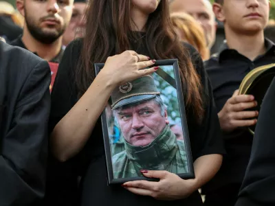 FILE PHOTO: People attend a funeral of former Bosnian Serb wartime general Ratko Mladic at the Topcider Cemetery in Belgrade, Serbia, September 7, 2026. REUTERS/Zorana Jevtic/File Photo
