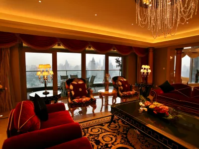 A general view shows the Huangpu River and its high raised buildings along the bank, out of the living room of an apartment at the Tomson's Riviera project in Shanghai July 19, 2006. Nine months after opening in Shanghai, China's most expensive luxury apartment complex has yet to attract a single buyer, but developer Tomson Group Ltd. is not about to slash prices to get people in. The development's 220 luxury apartments now carry price tags averaging 110,000 yuan (,750) per square metre (,275 per square foot). REUTERS/Nir Elias (CHINA)