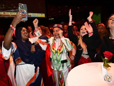 Social Democrats react to the presentation of the exit poll at the Social Democrats' election night watch party, in Stockholm, Sunday, Sept. 13, 2026. (Jonas Ekstr&ouml;mer/TT News Agency via AP)