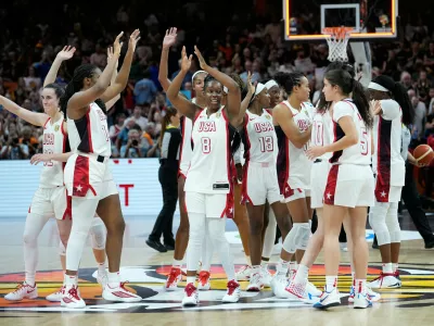 United States players celebrate after the Women's Basketball World Cup final match between the United States and France in Berlin, Sunday, Sept. 13, 2026. (AP Photo/Ebrahim Noroozi)