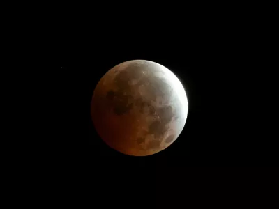 The moon appears in the sky during a partial lunar eclipse over Madrid, Spain, August 28, 2026. REUTERS/Thomas Peter