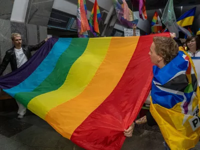 LGBTQ+ activists hold a rally at an underground metro stationto be protected from Russian regular air attacks in central Kharkiv, Ukraine, Saturday, Sept. 12, 2026. (AP Photo/Andrii Marienko)
