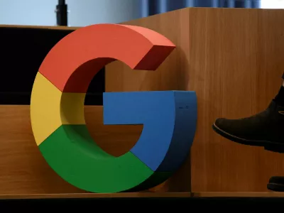 FILE PHOTO: A Google sign is pictured during the company's presentation of a detailed investment plan for Germany outside the Google office in Berlin, Germany, August 31, 2021. REUTERS/Annegret Hilse/File Photo