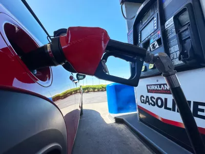 FILE - A motorist fills up the tank of a vehicle at a Costco gasoline station Wednesday, April 15, 2026, in Sheridan, Colo. (AP Photo/David Zalubowski, file)