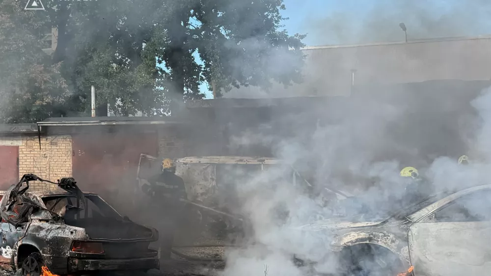 In this photo provided by the Ukrainian Emergency Service, firefighters put out a fire involving private vehicles following a Russian air attack in Kyiv, Ukraine, Wednesday, Sept. 16, 2026. (Ukrainian Emergency Service via AP)