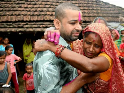 Nepali hydropower worker Sanjay Sah (L) breaks down after meeting his mother at his residence in Nepal's Saptari district on September 13, 2026 after being rescued from a flooded tunnel in the aftermath of deadly flash floods. For 10 days, Nepali hydropower worker Sanjay Sah survived in darkness inside a flooded tunnel, drinking muddy water and losing all sense of time as he desperately prayed for rescue.,Image: 1134122125, License: Rights-managed, Restrictions: "The erroneous mention[s] appearing in the metadata of this photo by Deepesh Deo Joshi has been modified in AFP systems in the following manner: [September 13] instead of [September 12]. Please immediately remove the erroneous mention[s] from all your onli, Model Release: no 