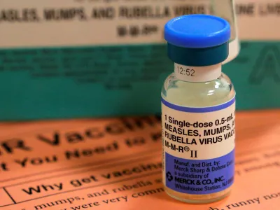 FILE PHOTO: A vial of measles, mumps and rubella vaccine and an information sheet is seen at Boston Children's Hospital in Boston, Massachusetts February 26, 2015.  REUTERS/Brian Snyder/File Photo