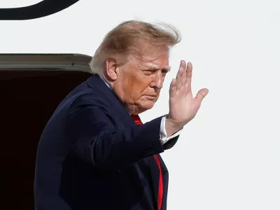 President Donald Trump waves as he boards Air Force One upon his departure at Joint Base Andrews, Md., Wednesday, Sept. 16, 2026. (AP Photo/Luis M. Alvarez)