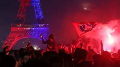 PSG supporters celebrate in Paris, Saturday, May 30, 2026 after the Champions League final soccer match between Paris Saint-Germain and Arsenal that's being played in Budapest, PSG won the match. (AP Photo/Thomas Padilla)