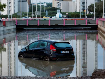 A car partially submerged at the entrance of a flooded underpass after heavy rain in Torrent, near Valencia, Spain, September 17, 2026. REUTERS/Eva Manez
