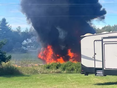 Smoke rises after an F-16 fighter jet crashed in a rural area near Traverse City, Mich., Thursday, Sept. 17, 2026. (Rebecca Lamberson via AP)