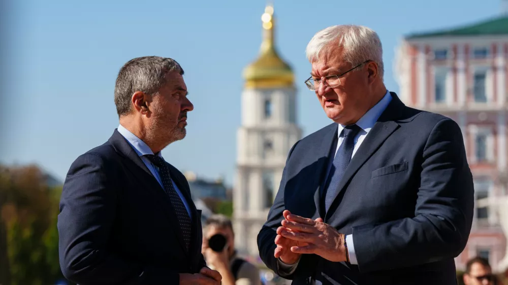 Slovenian Foreign Minister Tone Kajzer, left, and Ukrainian Foreign Minister Andrii Sybiha speak at Saint Michael's Square in Kyiv, Ukraine, on Thursday, September 17, 2026. (AP Photo/Evgeniy Maloletka)