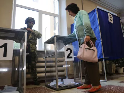 A voter casts a ballot during Russia's parliamentary election, in Donetsk, the Russian-controlled part of the Donetsk region, Ukraine, Friday, Sept. 18, 2026. (AP Photo)