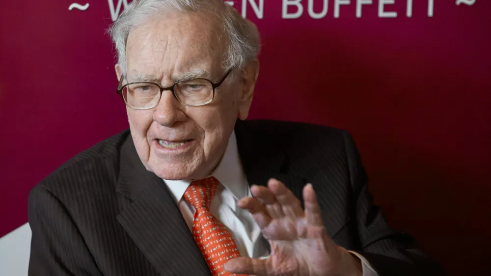 FILE - Warren Buffett, chairman and CEO of Berkshire Hathaway, speaks during a game of bridge following the annual Berkshire Hathaway shareholders meeting May 5, 2019, in Omaha, Neb. (AP Photo/Nati Harnik, File)