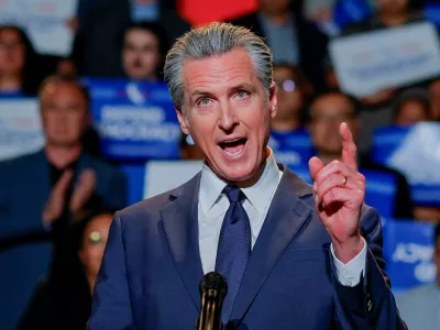 FILE PHOTO: California Governor Gavin Newsom, along with local congressional representatives, state officials and supporters, speaks as he announces the redrawing of California's congressional maps, calling on voters to approve a ballot measure, in response to a similar move in Texas being supported by U.S. President Donald Trump, in Los Angeles, California, U.S., August 14, 2025. REUTERS/Mike Blake/File Photo
