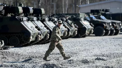 FILE PHOTO: A member of the military walks at the US army base at Grafenwoehr, Germany March 11, 2022. REUTERS/Andreas Gebert/File Photo