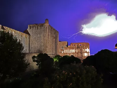 The storm, the lightning. Pile gate of the fortress at night in Dubrovnik on Adriatic sea, Croatia