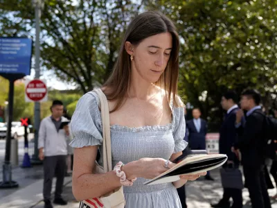 Politico White House reporter Cheyenne Haslett is pictured near the White House complex after having her credential revoked following President Donald Trump's ban on CNN, MS NOW and Politico, Saturday, Sept. 19, 2026, in Washington. (AP Photo/Jose Luis Magana)