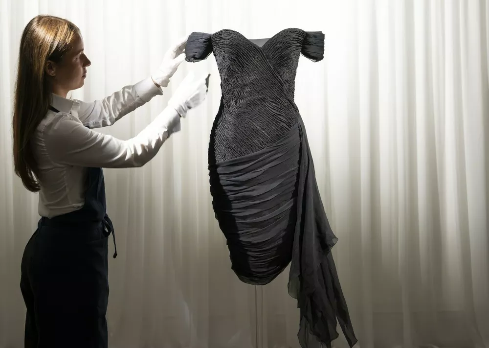 Exclusive unveiling of Princess Diana?s Revenge Dress at Sotheby?s London. One of the most legendary fashion items in modern history is exhibited for the first time since 1997. The iconic black silk evening dress was designed by Christina Stambolian and famously worn by Diana, Princess of Wales, at the Serpentine Gallery in 1994.Pictured: general view,Image: 1136017871, License: Rights-managed, Restrictions: Worldwide, Model Release: no, Pictured: general view 