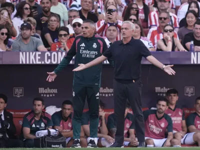 Real Madrid's head coach Jose Mourinho, right, gestures during a Spanish La Liga soccer match between Atletico Madrid and Real Madrid in Madrid, Sunday, Sept. 20, 2026. (AP Photo/Bernat Armangue)