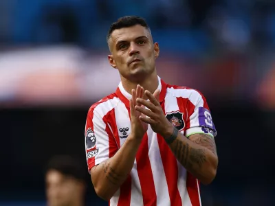 Soccer Football - Premier League - Manchester City v Sunderland - Etihad Stadium, Manchester, Britain - September 20, 2026 Sunderland's Granit Xhaka applauds fans after the match Action Images via Reuters/Lee Smith EDITORIAL USE ONLY. NO USE WITH UNAUTHORIZED AUDIO, VIDEO, DATA, FIXTURE LISTS, CLUB/LEAGUE LOGOS OR 'LIVE' SERVICES. ONLINE IN-MATCH USE LIMITED TO 120 IMAGES, NO VIDEO EMULATION. NO USE IN BETTING, GAMES OR SINGLE CLUB/LEAGUE/PLAYER PUBLICATIONS. PLEASE CONTACT YOUR ACCOUNT REPRESENTATIVE FOR FURTHER DETAILS..