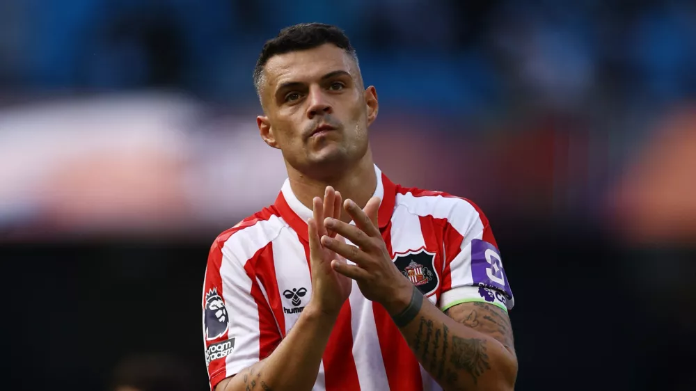 Soccer Football - Premier League - Manchester City v Sunderland - Etihad Stadium, Manchester, Britain - September 20, 2026 Sunderland's Granit Xhaka applauds fans after the match Action Images via Reuters/Lee Smith EDITORIAL USE ONLY. NO USE WITH UNAUTHORIZED AUDIO, VIDEO, DATA, FIXTURE LISTS, CLUB/LEAGUE LOGOS OR 'LIVE' SERVICES. ONLINE IN-MATCH USE LIMITED TO 120 IMAGES, NO VIDEO EMULATION. NO USE IN BETTING, GAMES OR SINGLE CLUB/LEAGUE/PLAYER PUBLICATIONS. PLEASE CONTACT YOUR ACCOUNT REPRESENTATIVE FOR FURTHER DETAILS..