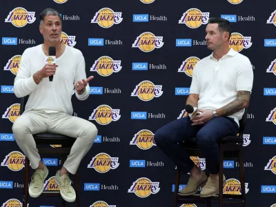 Sep 24, 2026; Los Angeles, CA, USA; Los Angeles Lakers president of basketball operations and general manager Rob Pelinka (left) and head coach JJ Redick speak to the media during a press conference at UCLA Health Training Center. Mandatory Credit: Kiyoshi Mio-Imagn Images