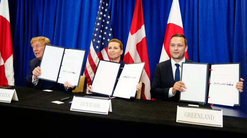 Denmark's Prime Minister Mette Frederiksen, center, Greenland's Prime Minister Jens-Frederik Nielsen, right, and US President Donald Trump at the signing ceremony of a security deal between the U.S., Denmark and Greenland at United Nations headquarters, Tuesday, Sept. 22, 2026. (Mads Claus Rasmussen/Ritzau Scanpix via AP)