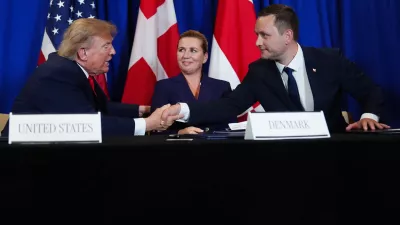 President Donald Trump shakes hands with Greenland's Prime Minister Jens-Frederik Nielsen, before signing a security agreement during the United Nations General Assembly, Tuesday, Sept. 22, 2026, at the UN headquarters, as Denmark's Prime Minister Mette Frederiksen, center, looks on. (AP Photo/Julia Demaree Nikhinson)