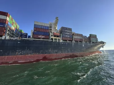 In this photo provided by Ukraine's Infrastructure Ministry Press Office, container ship Joseph Schulte (Hong Kong flag) leaves the port of Odesa to proceed through the temporary corridor established for merchant vessels from Ukraine's Black Sea ports in Odesa, Ukraine, Wednesday, Aug. 16, 2023. The ship carrying over 30 thousand tons of cargo, including food products, which had been in the port of Odesa since last February because of the Russian invasion of Ukraine, left Odessa under an agreement between Ukraine and the International Maritime Organisation. (Ukraine's Infrastructure Ministry Press Office via AP)