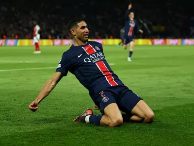 Soccer Football - Champions League - Semi Final - Second Leg - Paris St Germain v Arsenal - Parc des Princes, Paris, France - May 7, 2025 Paris St Germain's Achraf Hakimi celebrates scoring their second goal REUTERS/Gonzalo Fuentes   TPX IMAGES OF THE DAY
