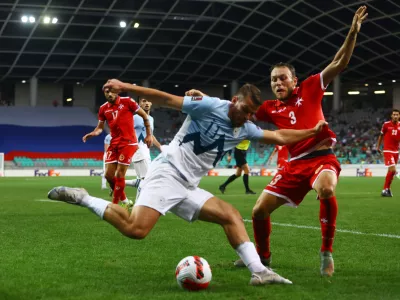 Soccer Football - World Cup - UEFA Qualifiers - Group H - Slovenia v Malta - Stozice Stadium, Ljubljana, Slovenia - September 4, 2021 Slovenia's Domen Crnigoj in action with Malta's Ryan Camenzuli REUTERS/Borut Zivulovic