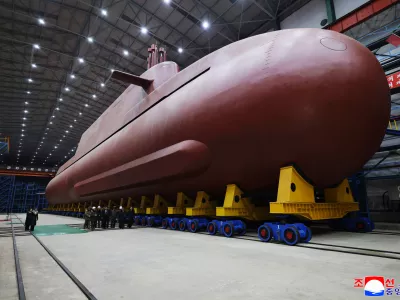 In this undated photo provided Thursday, Dec. 25, 2025, by the North Korean government, its leader Kim Jong Un inspects a nuclear-powered submarine under construction at an undisclosed location in North Korea. Independent journalists were not given access to cover the event depicted in this image distributed by the North Korean government. The content of this image is as provided and cannot be independently verified. Korean language watermark on image as provided by source reads: "KCNA" which is the abbreviation for Korean Central News Agency. (Korean Central News Agency/Korea News Service via AP)