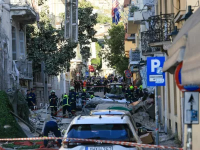 Emergency personnel work at the site where an old building partially collapsed following an explosion, at the touristy Plaka area in central Athens, Greece, September 25, 2026. REUTERS/Louisa Gouliamaki