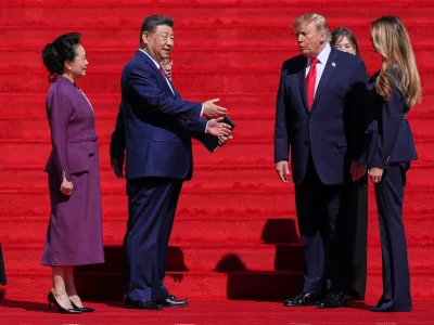President Donald Trump, center right, and first lady Melania Trump, right, speak with China's President Xi Jinping, center left, and his wife Peng Liyuan&nbsp;on the steps of the National Archives Museum, Friday, Sept. 25, 2026, in Washington. (AP Photo/Julia Demaree Nikhinson)