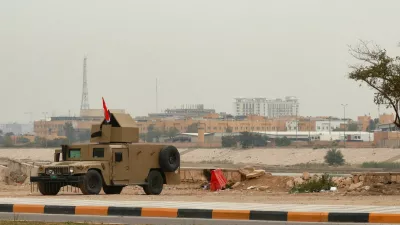 An Iraqi army Humvee stands guard near the U.S. Embassy, after Iraqi security sources said the embassy was hit in a missile attack, in Baghdad, Iraq, March 14, 2026. REUTERS/Ahmed Saad