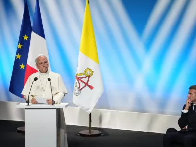 French President Emmanuel Macron, right, listens to Pope Leo XIV delivering his speech at the meeting At the Roots of Europe for Peace and Unity, Monday, Sept. 28, 2026, in Metz, France. (AP Photo/Gregorio Borgia)