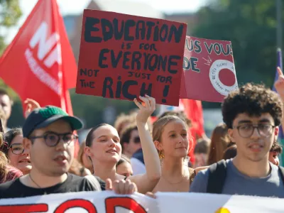 Protesters march against the government's release of next year's draft budget, in Lille, France, Tuesday, Sept. 29, 2026. (AP Photo/Jean-Francois Badias)