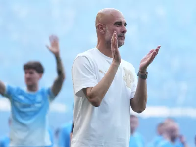 FILE - Manchester City's head coach Pep Guardiola applauds the fans after his last game with the club after a Premier League soccer match between Manchester City and Aston Villa in Manchester, England, May 24, 2026. (AP Photo/Alastair Grant, File)