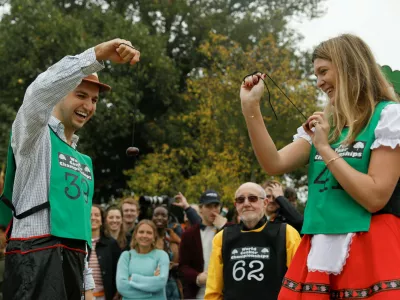 Competitors take part in the first round of the annual World Conker Championships in Southwick, Britain, October 12, 2025. REUTERS/Temilade Adelaja